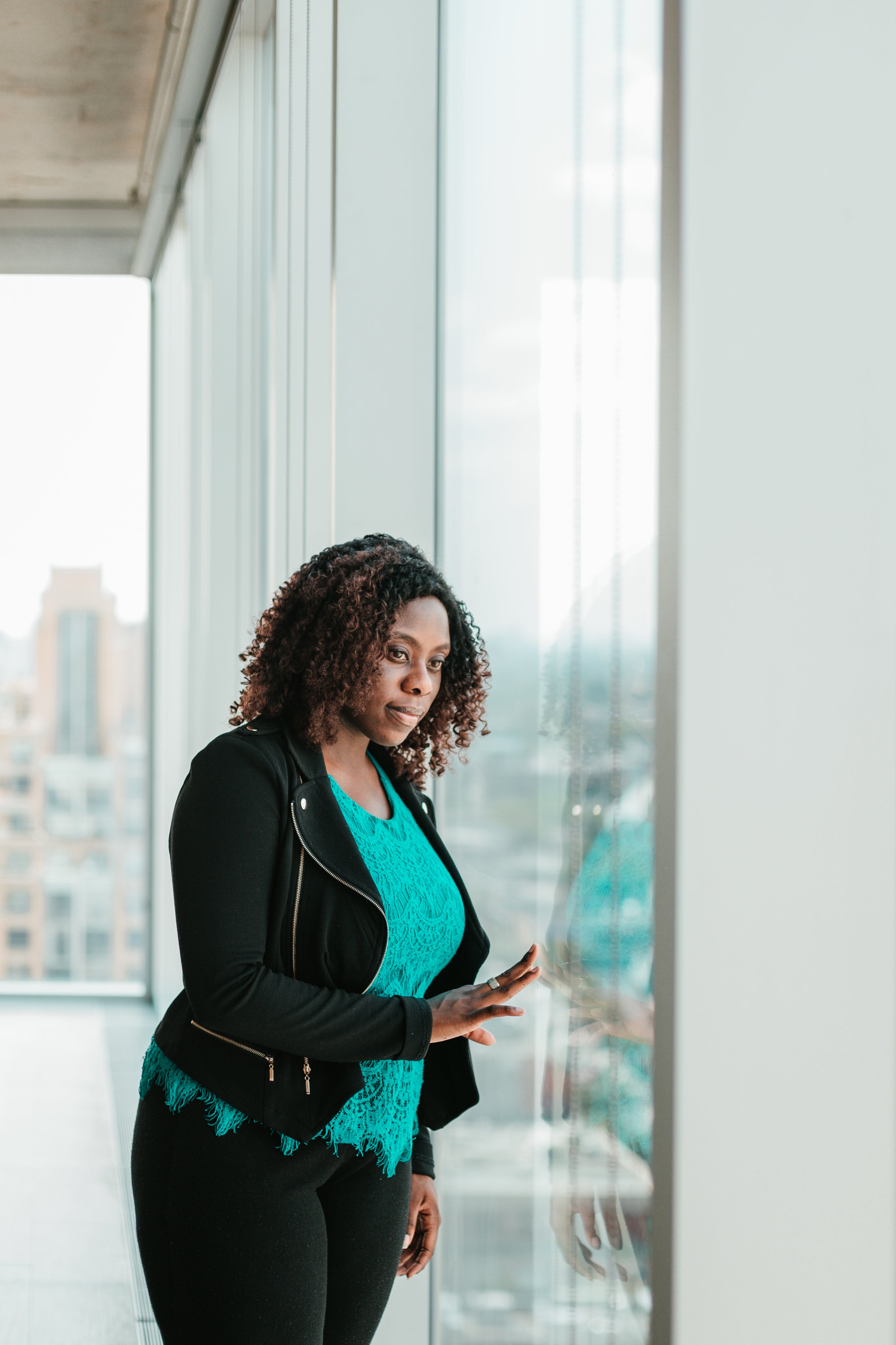 files/woman-looking-out-woman-from-highrise-office.jpg